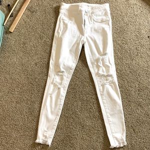White skinny jeans somewhat distressed